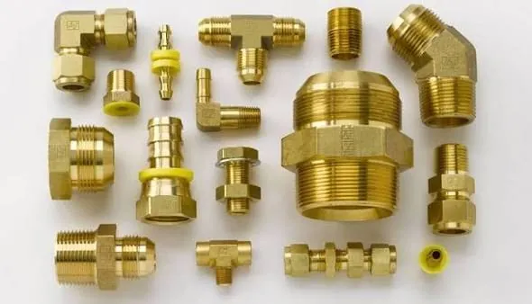 Assorted brass pipe fittings: elbows, tees and couplings